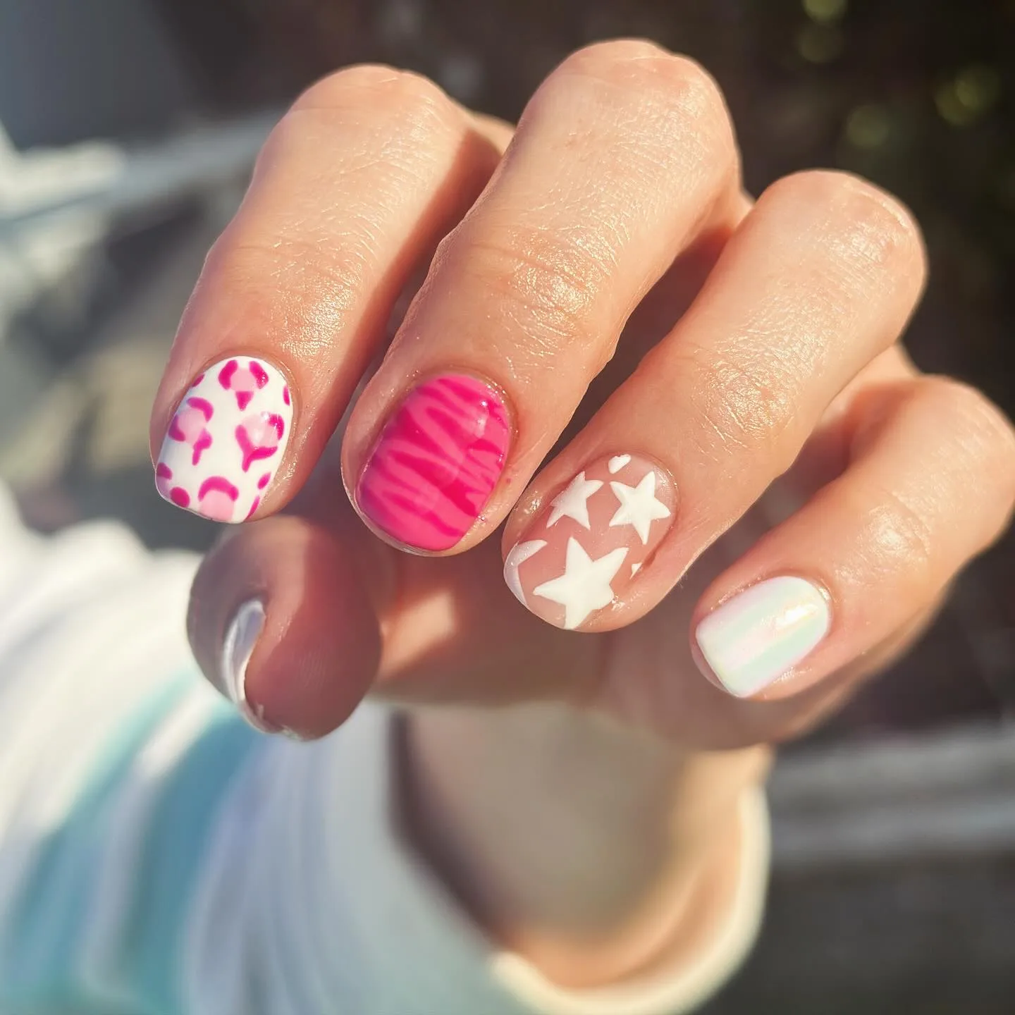 Nail art from Casey's review — pink leopard and star designs
